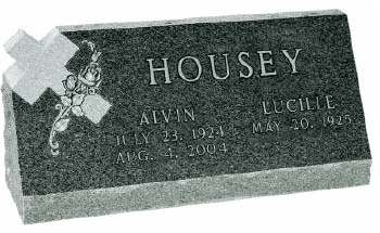 slant memorial headstone featuring religous imagery
